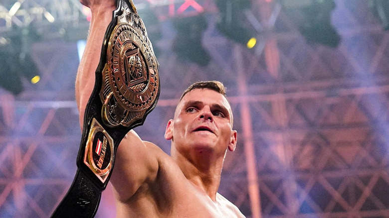 GUNTHER holding up the WWE Intercontinental Championship