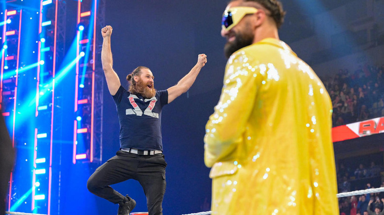 Sami Zayn poses as Seth Rollins laughs