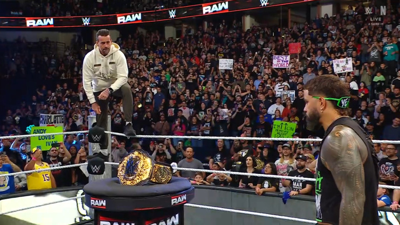 Punk and Jey staring one another down in the ring
