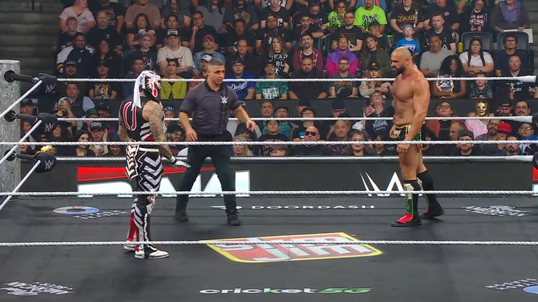 Penta and Rusev staring one another down