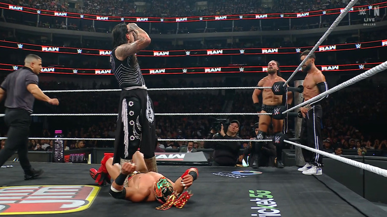 Dominik posing over Lee