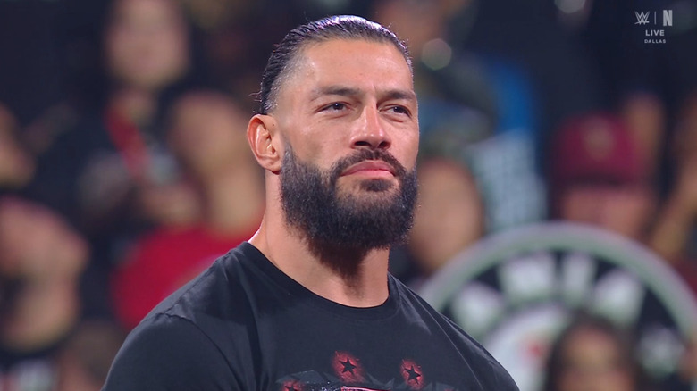 Reigns standing in the ring