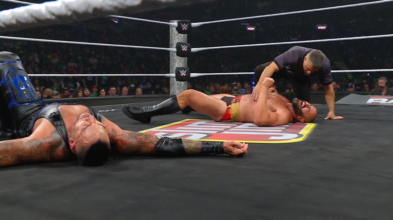 Priest and Rusev both down in the ring