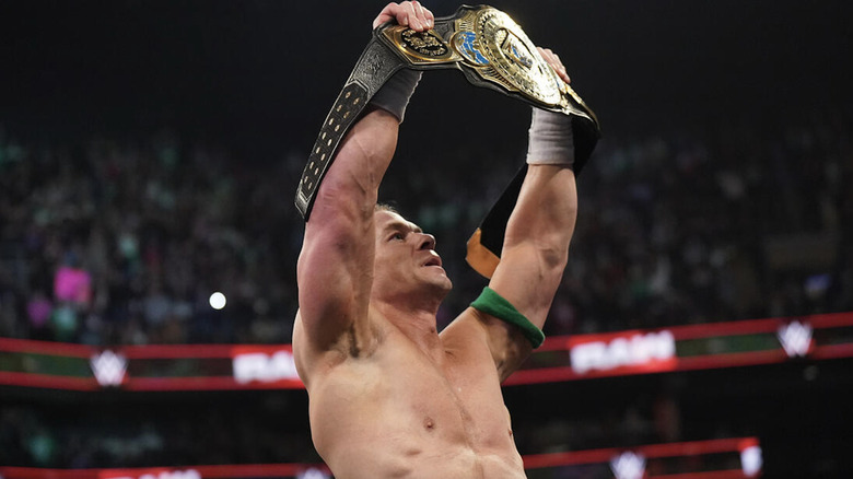 Cena holding up the Intercontinental Championship