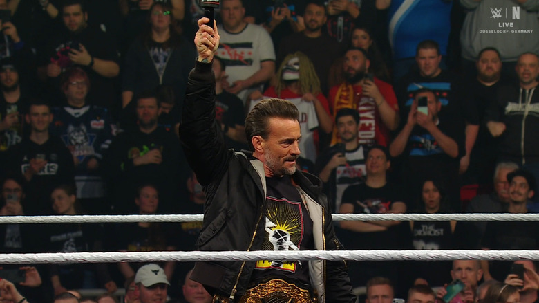 Punk holding up the microphone