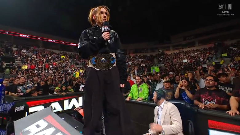 Lynch standing on the announce desk