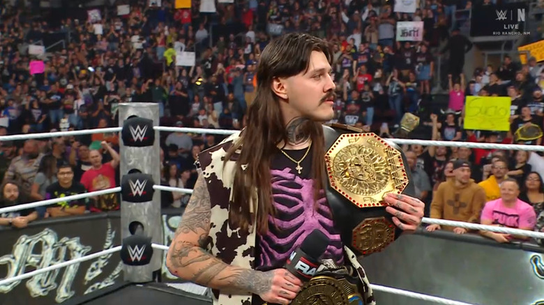 Dominik in the ring with his title belts