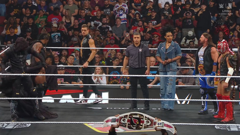 The New Day, Styles, and Lee all in the ring