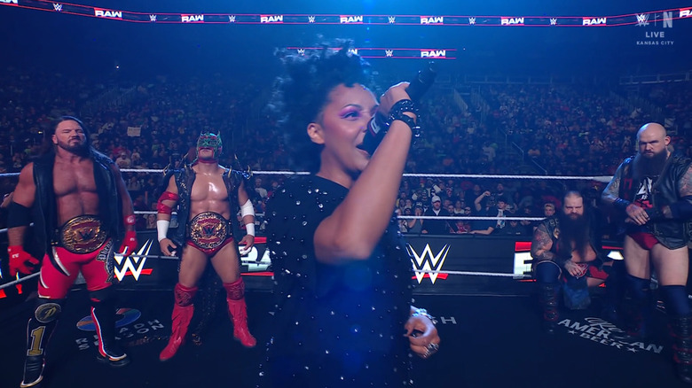 Styles, Lee, and The War Raiders in the ring during the ring announcement