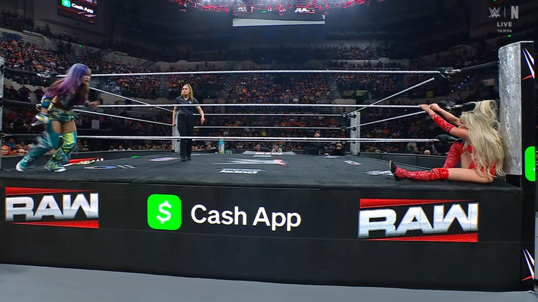 Sane and Morgan brawilng on the ring apron