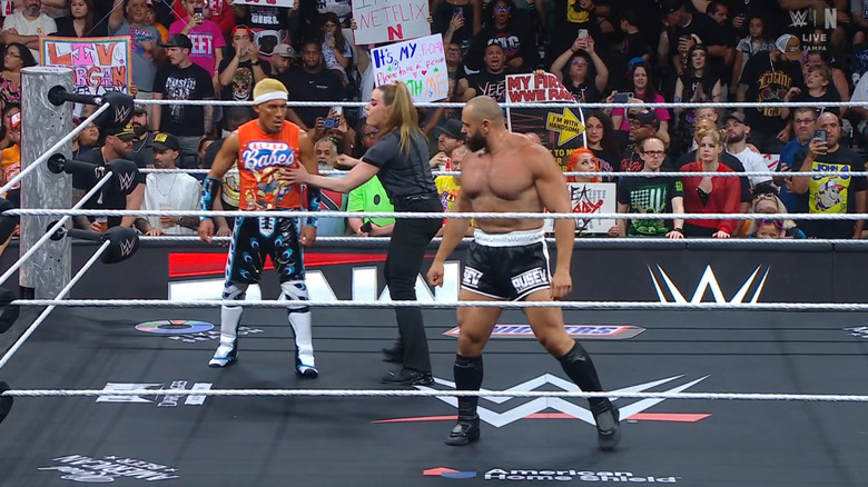Tozawa and Rusev staring one another down