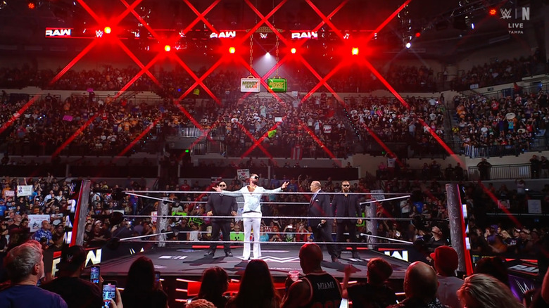 Reed, Rollins, Heyman, and Breakker in the ring
