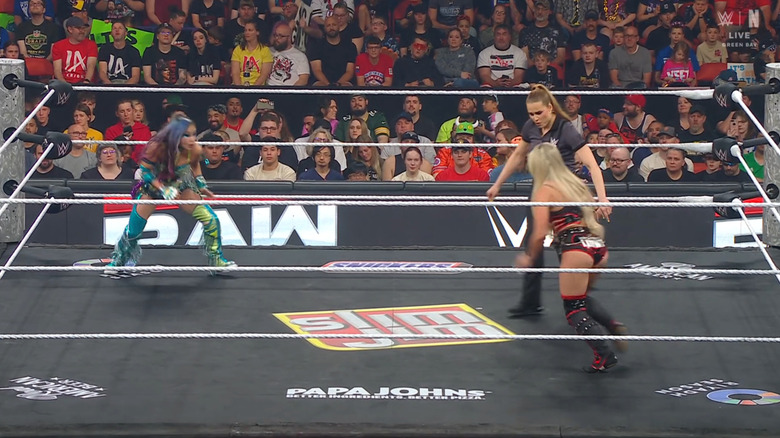 Sane and Morgan inside the ring staring each other down
