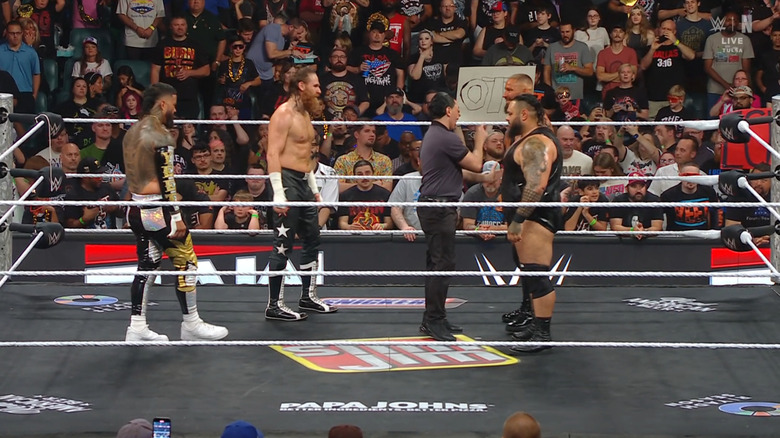 The four men staring each other down inside the ring