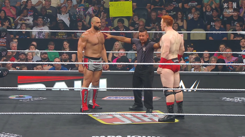 Rusev and Sheamus staring each other down in the ring