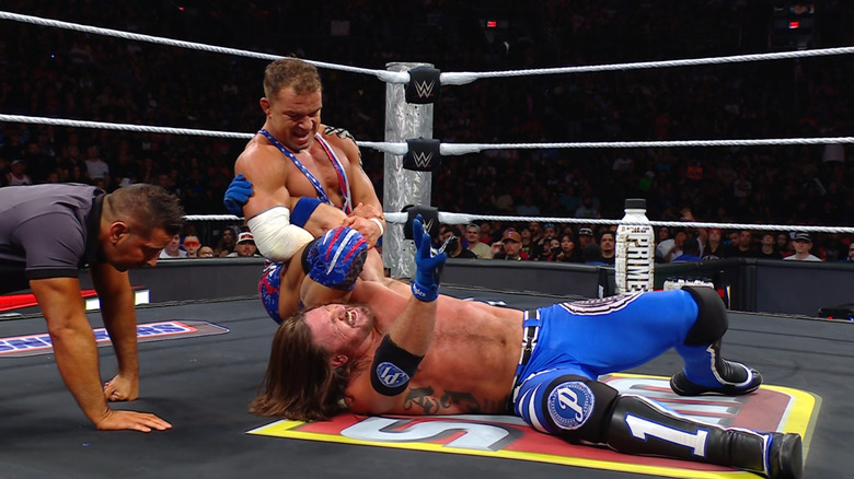 Gable with an arm submission cinched in on Styles
