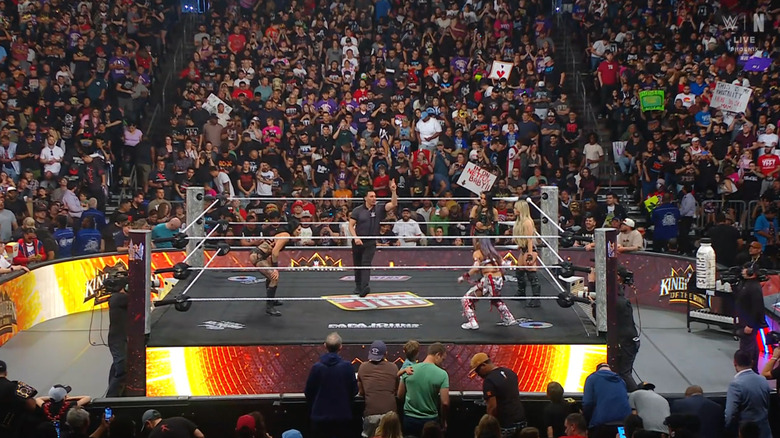 The four women in the ring staring one another down