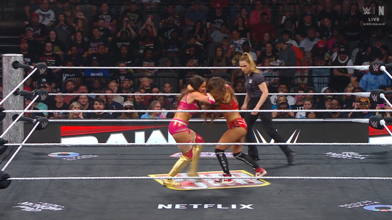 Green and Nikki locking up with one another