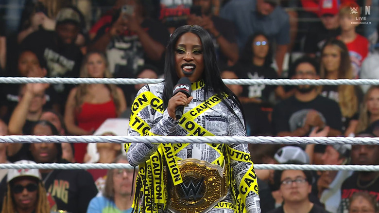 Naomi speaking in the ring