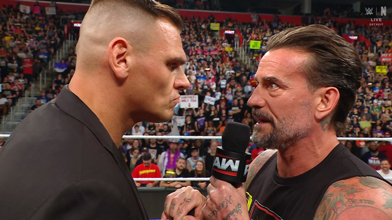 GUNTHER and Punk staring one another down