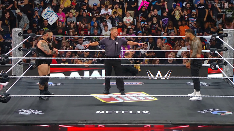 Reed and Jey staring one another down in the ring