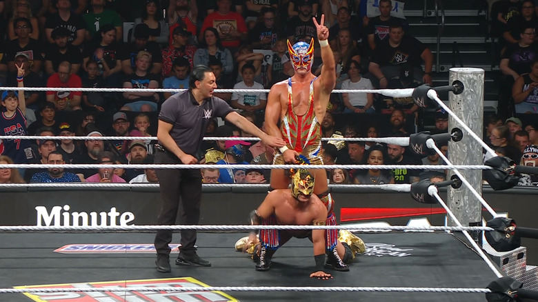 Americano standing over Lee