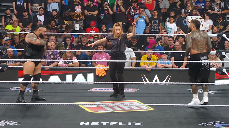 Reed staring down Jey inside the ring
