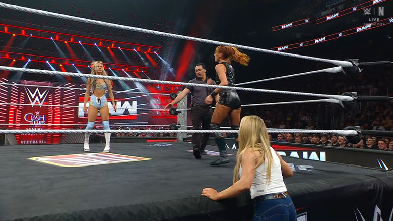 Dupri and Lynch in the ring as Natalya watches from the outside