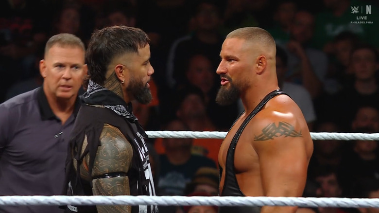 Jey and Breakker staring each other down in the ring