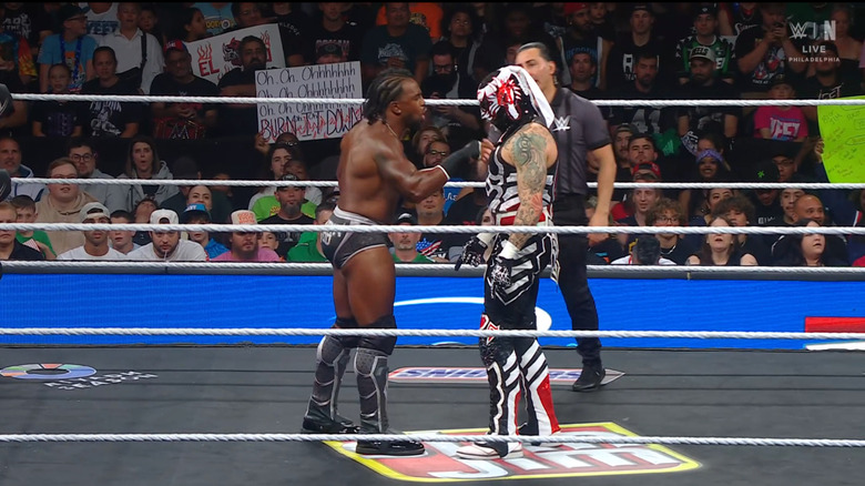 Woods and Penta staring one another down in the ring