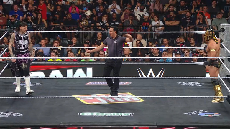 Dominik and Lee staring each other down in the ring