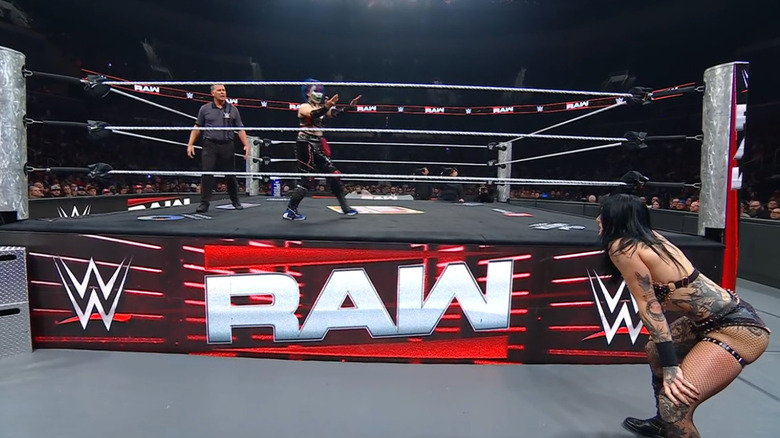 Asuka in the ring taunting Ripley on the outside