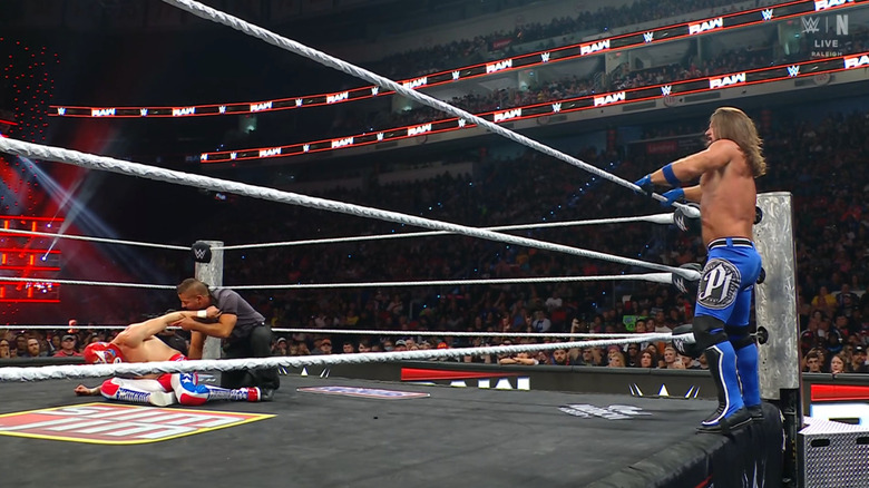 Styles setting up for the Phenomenal Forearm on Americano Ryo