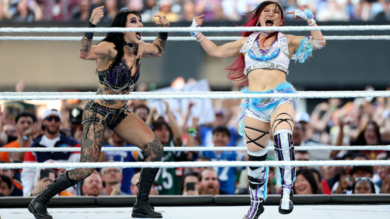Ripley and SKY in the ring hitting SKY's signature pose