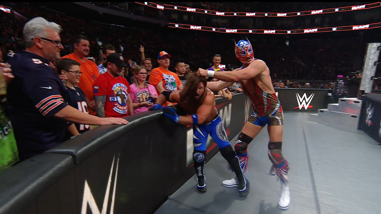 Americano about to dump Styles back in the ring from the outside