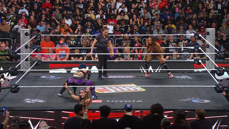 Asuka and Nikki staring each other down in the ring