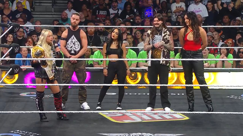 Liv Morgan and the Judgment Day in the ring