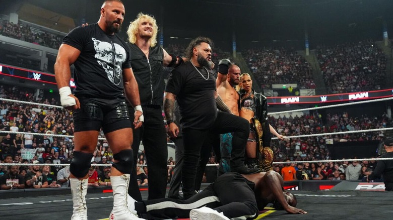 Bron Breakker, Logan Paul, Bron Breakker, with his foot on top of Oba Femi, Austin Theory, and Maxxine Dupri stan over the fallen "Ruler" in the middle of the ring on the September 7, 2026 edition of "WWE Raw."