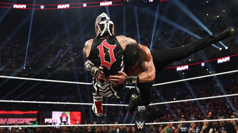 Roman Reigns spears Penta in the ring on "WWE Raw"