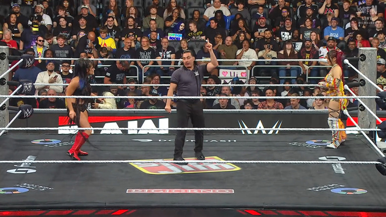 Valkyria and SKY staring down one another in the ring