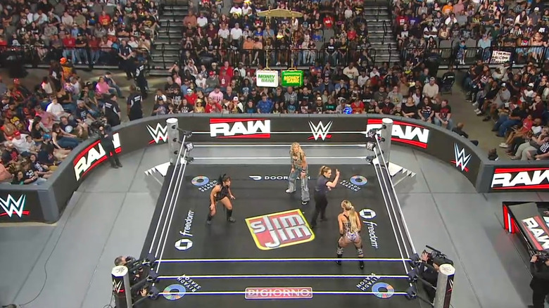 All three women staring down one another in the ring