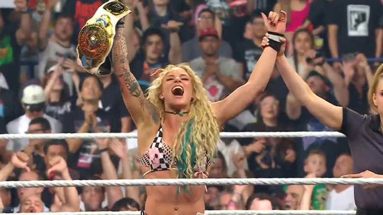 Sol Ruca celebrates with the Women's Intercontinental Championship