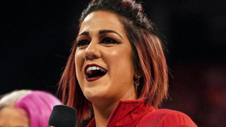 Bayley with a microphone