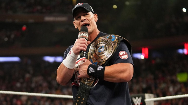 Intercontinental Champion John Cena cuts a promo in the ring, the title on his shoulder, to open an episode of 