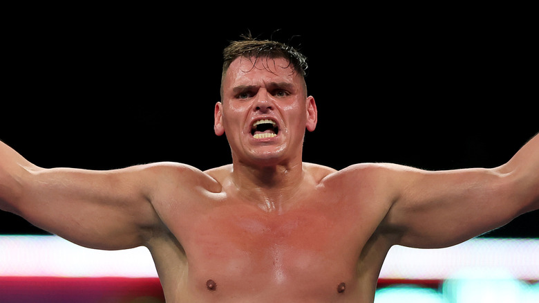 GUNTHER with his arms outstretched