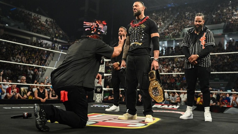 Jacob Fatu kneels before World Heavyweight Champion Roman Reigns, with the Usos flanking Reigns, during the acknowledge ceremony to open the June 1, 2026 edition of 