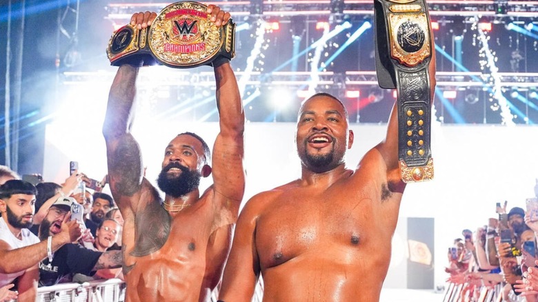 Montez Ford and Angelo Dawkins, the Street Profits, hold up their newly-won World Tag Team Championships after defeating The Vision on the June 22, 2026 edition of 