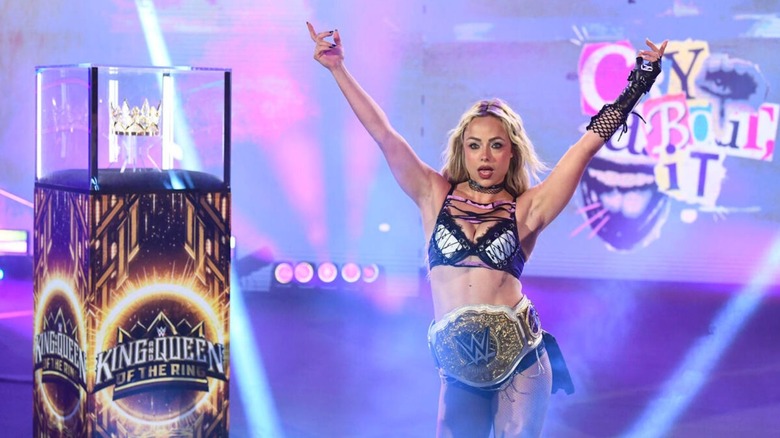 WWE Women's World Champion Liv Morgan struts down to the ring, beside the Queen of the Ring Crown, ahead of a four-way match in the tournament on the June 8, 2026 edition of 