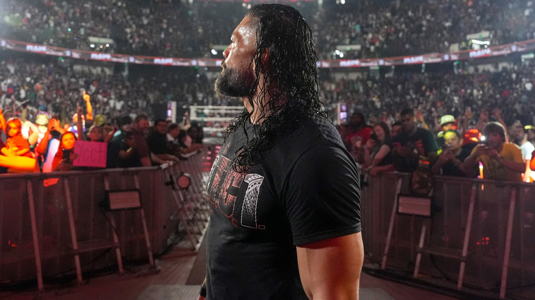 Roman Reigns looks towards the crowd following his return to 