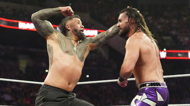 Jey Uso throws down with Seth Rollins